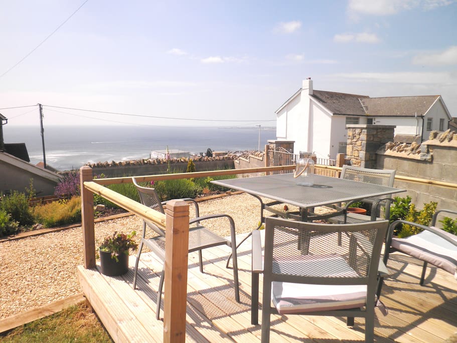 Enjoy alfresco meals from the front deck overlooking the sea. Walk 2 mins to our lovely village shop to pick up essentials or dine at the local restaurant