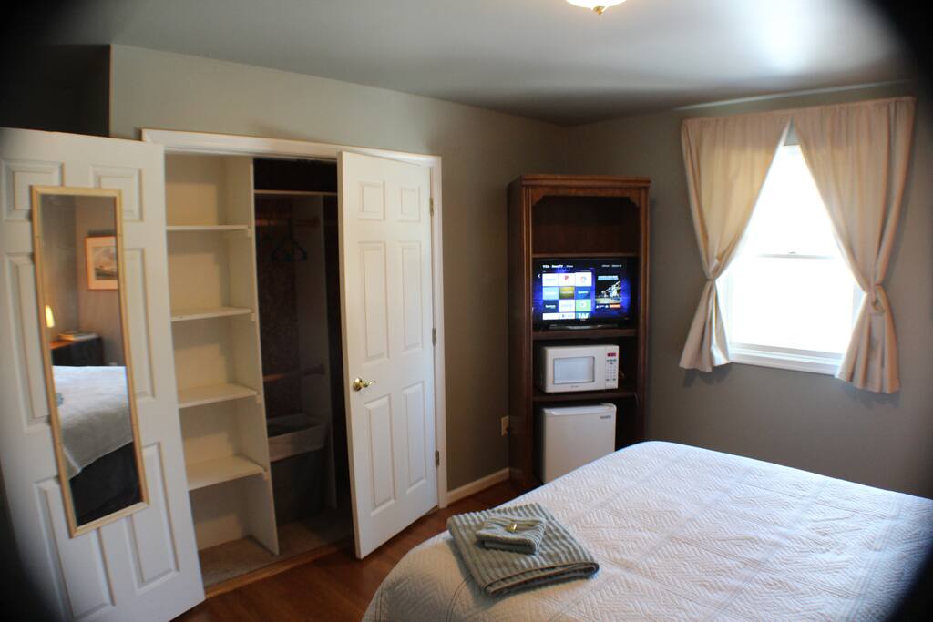 BR #1 with large closet, shelves, and full-length mirror