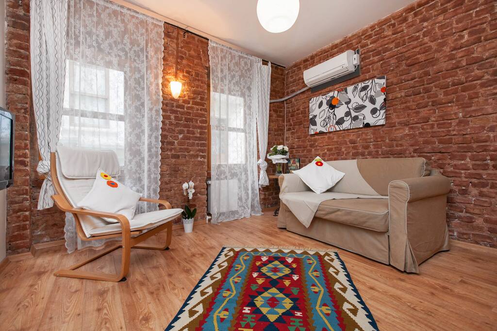 The living room(with the kitchen on its side, as visible in the next photo). The sofa opens up into a bed with a width of 1.40cm (bigger than a one person sized bed and smaller than a double).