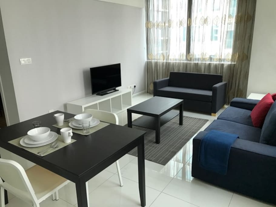 Coffee table and a side table provided. 40 inch TV screen provided with wireless connection.