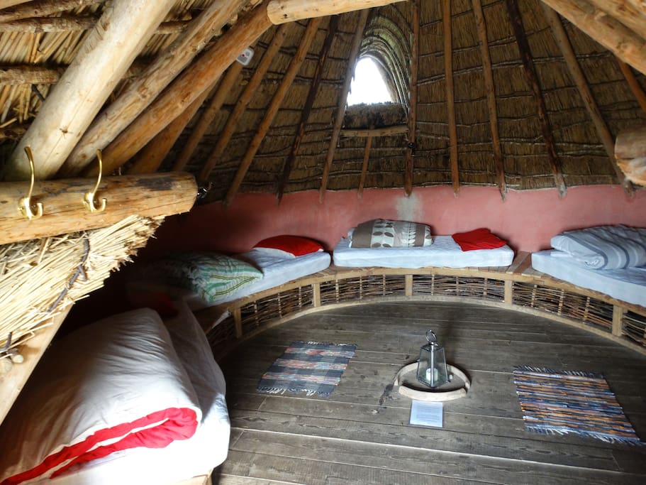 you can opt to have up to five single beds inside. Theres a west facing dormer window in the thatch roof to catch the evening light at bedtime and overhead reading lamps above three of the beds
