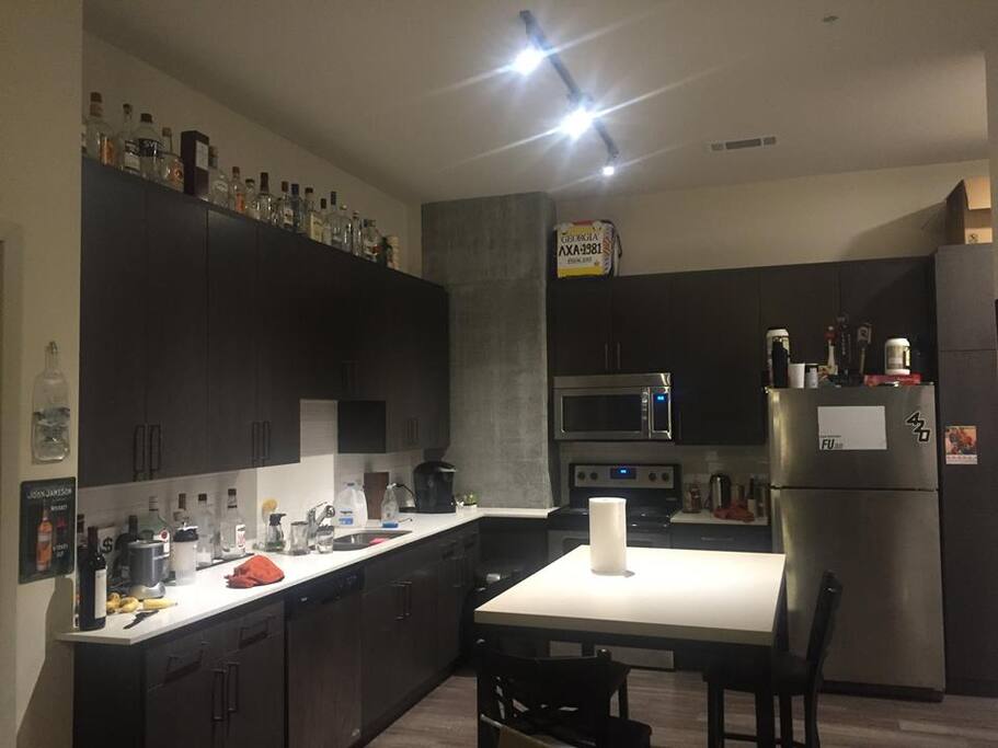 Full kitchen and dining area with utilities included.