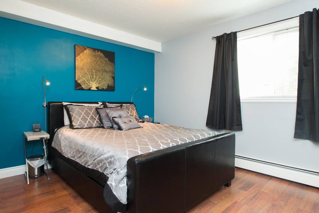 Master bedroom with modern finishings and Euro top queen bed