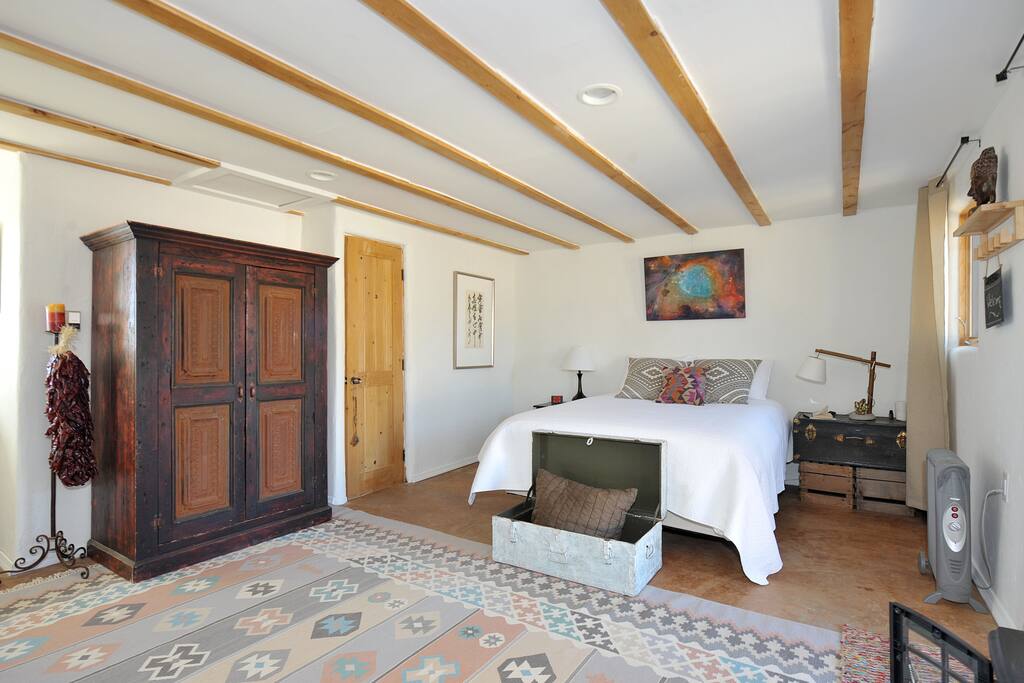 Door to the right of armoir is bathroom.