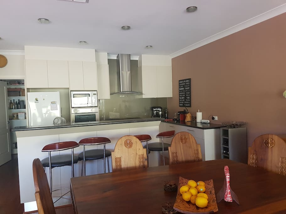 Spacious open plan kitchen kitchen that over look the entertain meant area and views