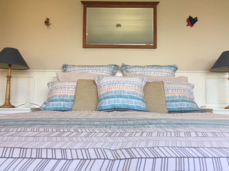 Queen size bed with quality linen