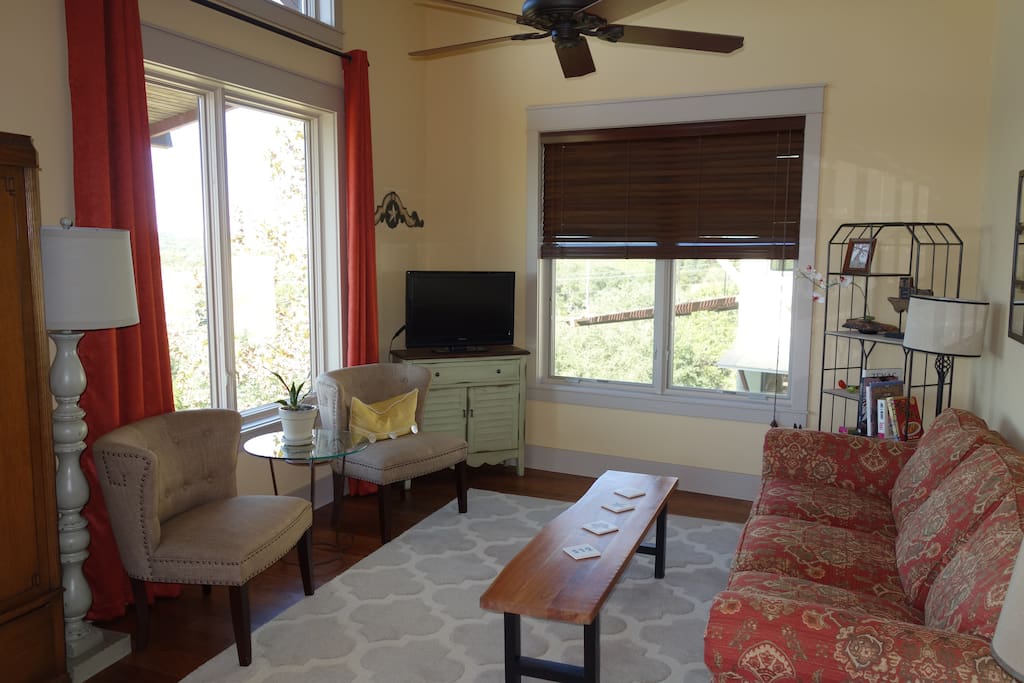 Spacious relaxing living room with lots of natural light and expansive views of the Hill Country.