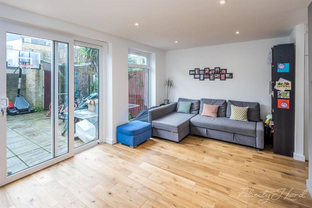 Spacious living room with comfy sofa that can turn into a large double bed.