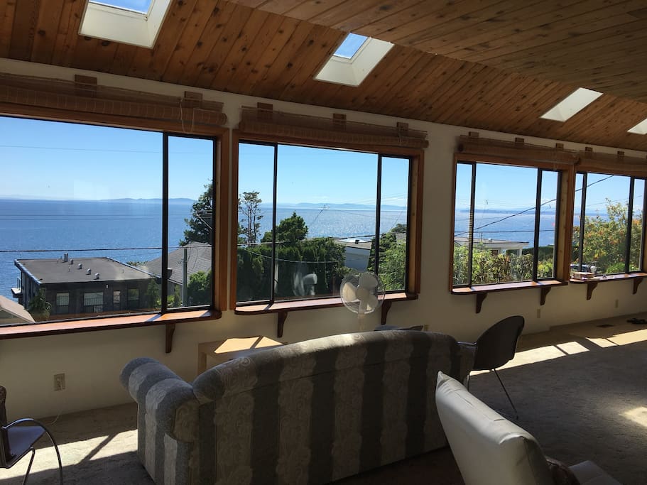 Open space, windows, and views of the ocean, mountains and islands.
