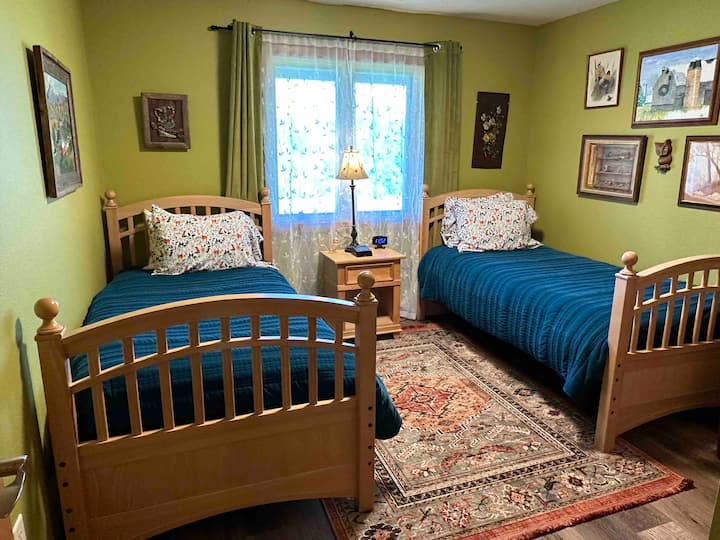 First level bedroom with two twin beds