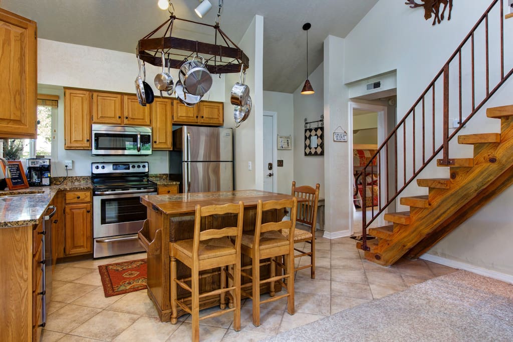 Seating for 3 around the island and stainless appliances