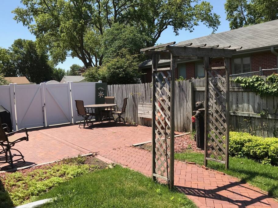 Outdoor space with gas grill.