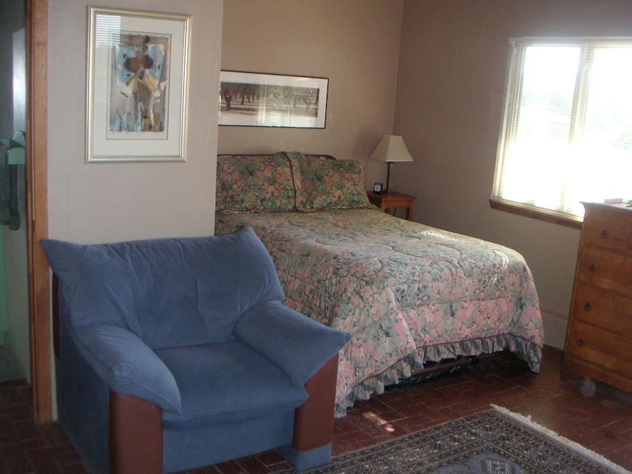 New queen sized bed in cozy alcove.