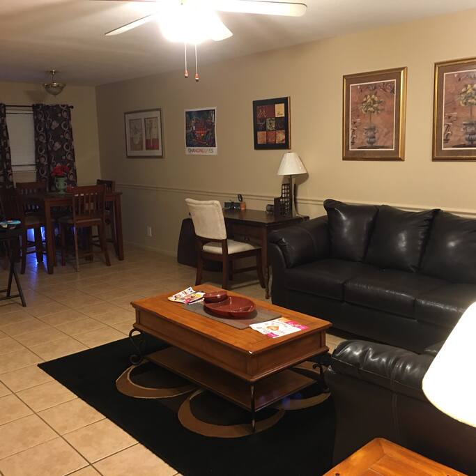 Living room with desk for writing , computer work area.