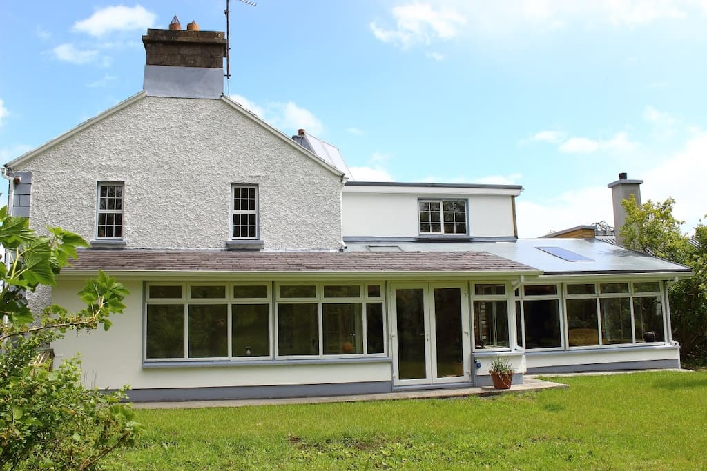 South west facing sun room with access to the orchard lawn.