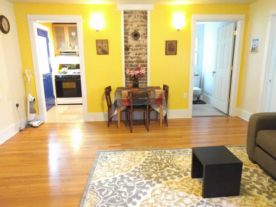 View from the living room. Kitchen on the left and bathroom on the right.