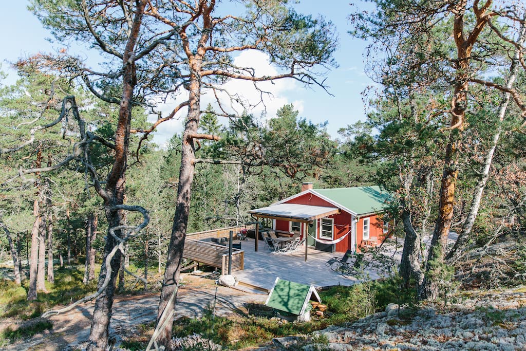The main part of the wooden deck is facing southwest and there is plenty of sun daytime and in the afternoons (the photo was taken early in the morning, when the sun hits the long side of the cabin).