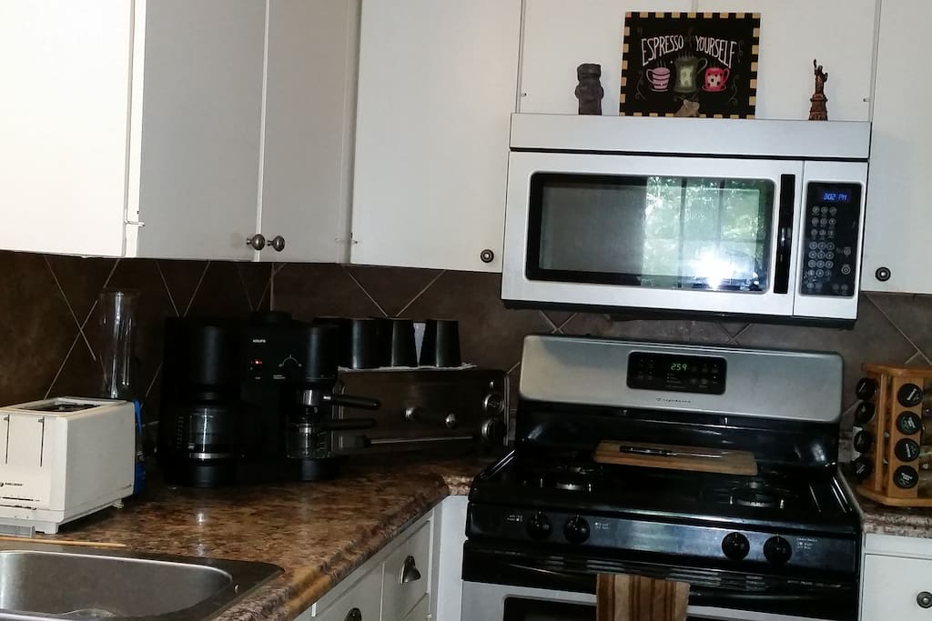 Modern Kitchen w/ coffee/espresso machine.