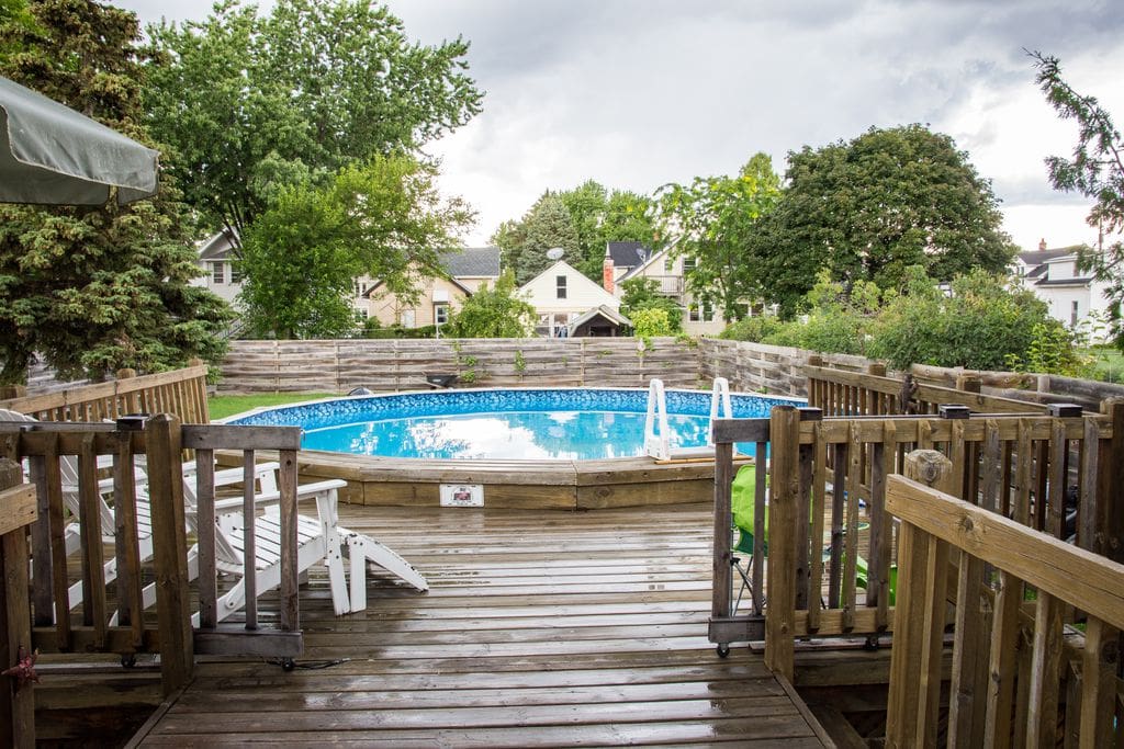 Outside deck, pool, and backyard.