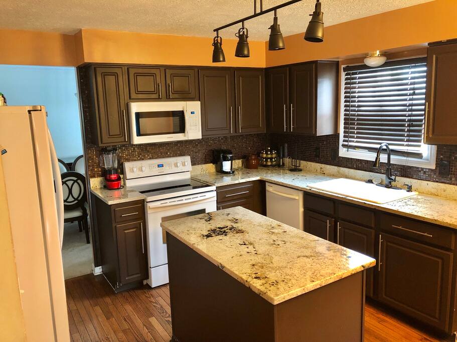 Kitchen area with window facing
in-ground pool and backyard area. Granite island provides great space to gather and make memories.