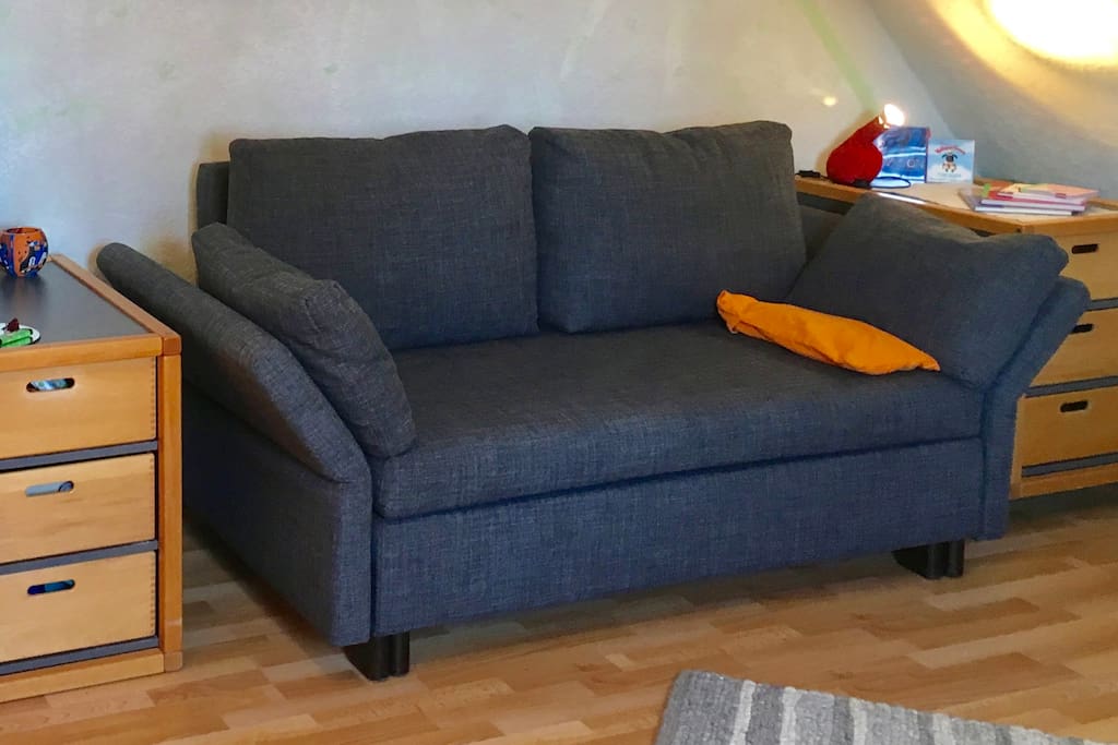 That's your bed sofa! Easy to re-arrange for the night, comfortable for 2 people - or just sleep like that if your a small single person.