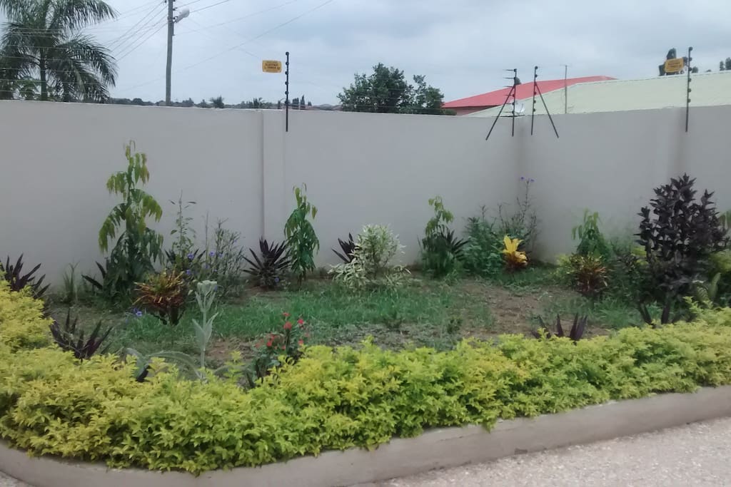 Large front garden and drive way .