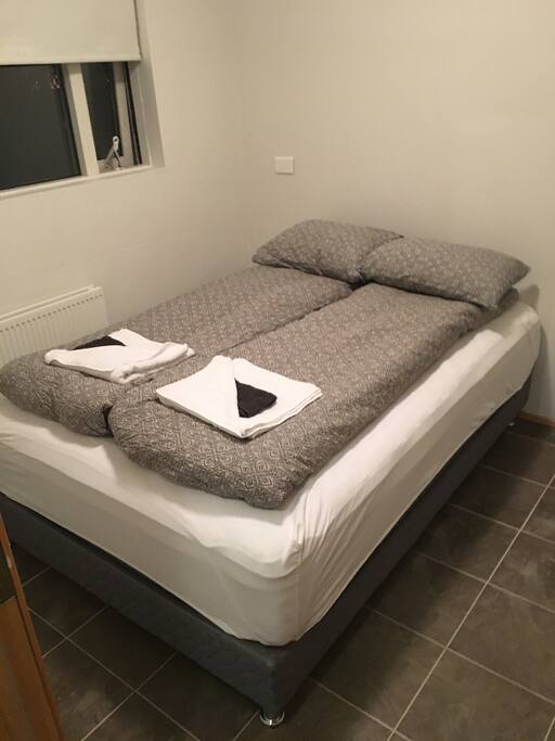 Double bed and window. Some nights Northern Lights are visible from the window.