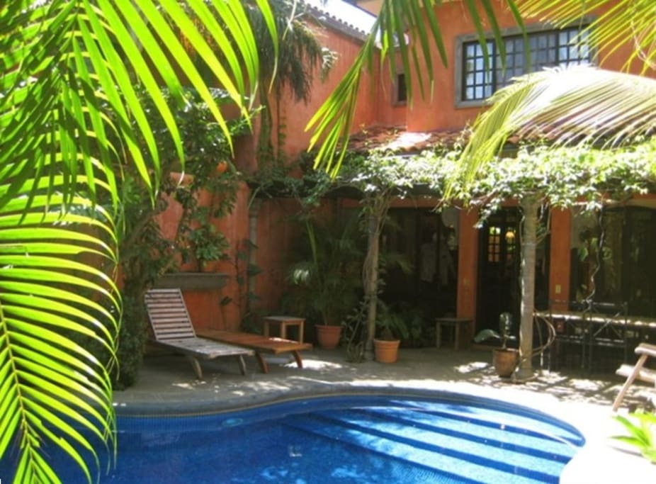 Private pool; view of upper back bedroom window.