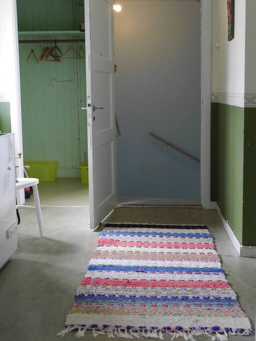 Hallway after coming up the staircase. You can sort your waste in the yellow bins and we will help you drive it to Munkedal's recycling station.
