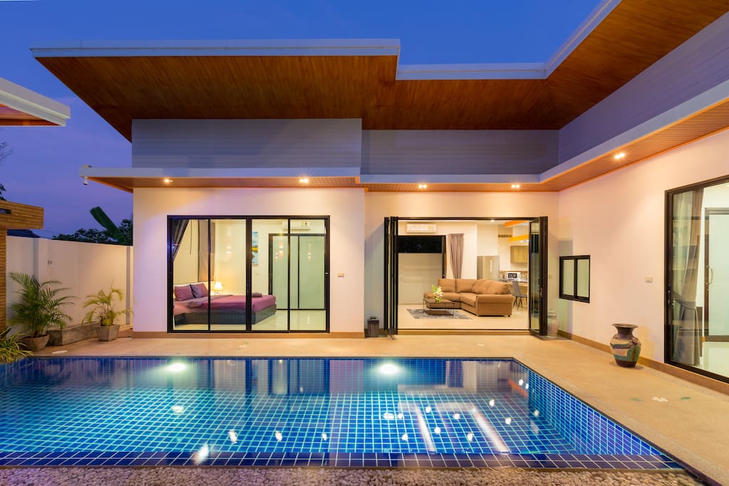 Bedroom 1 and living room opening on the pool