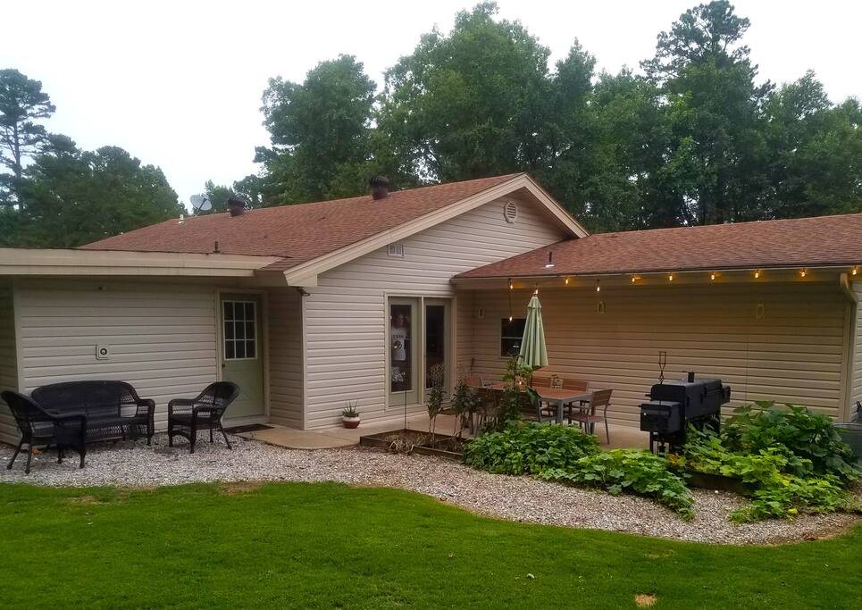 back yard is great for entertaining or relaxing with multiple seating areas, grill and fire pit