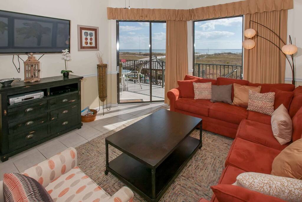 Living room with Gulf-front views from private balcony