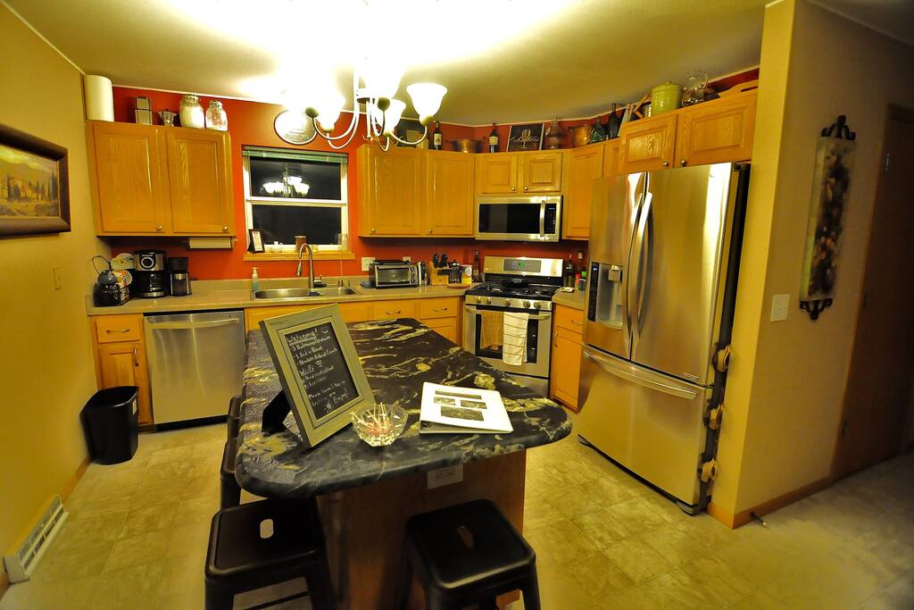Premium Appliances and huge Granite Island Bar.