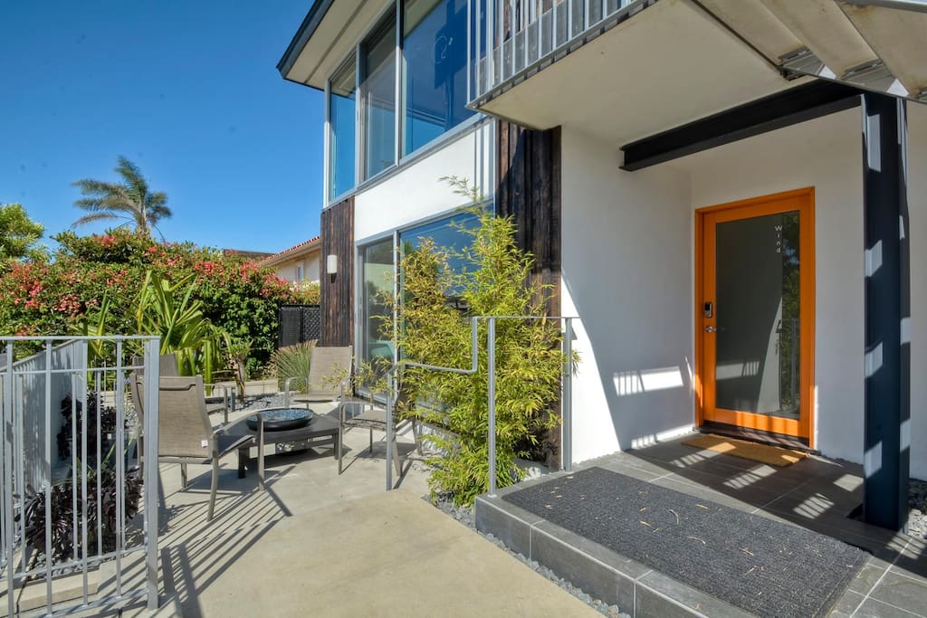 View of front door and private firepit.