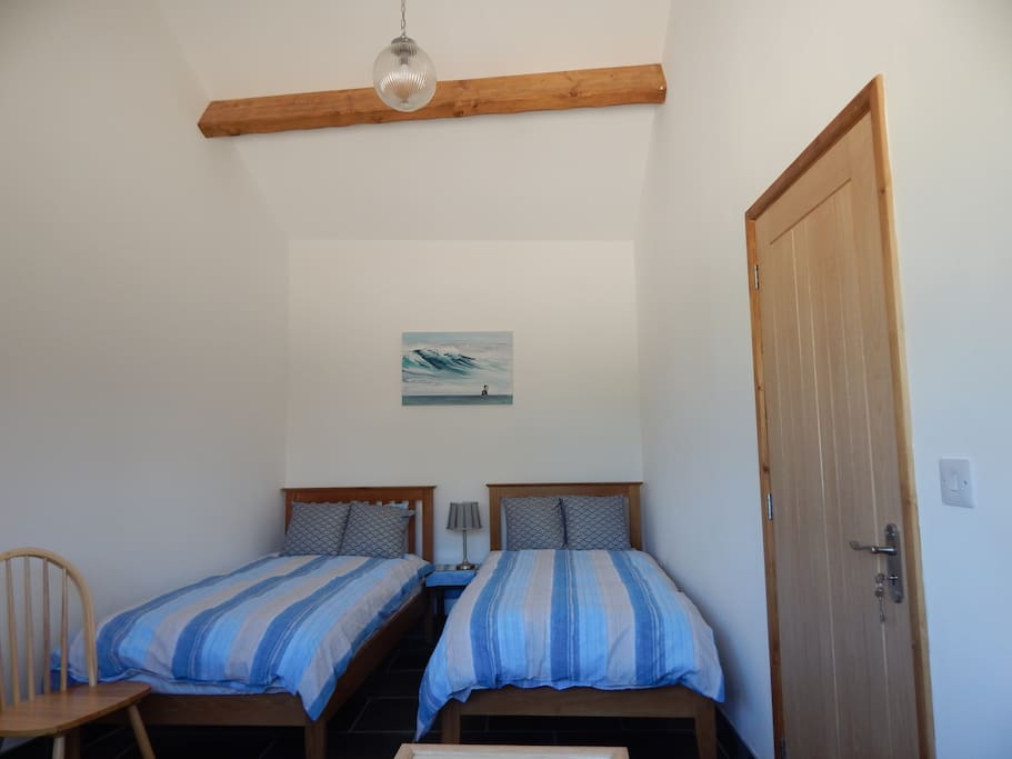 Twin beds room for cot