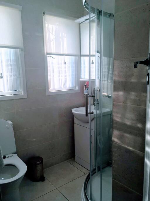 There are two bathrooms very close to your room. Both have a toilet, shower & wash hand basin.