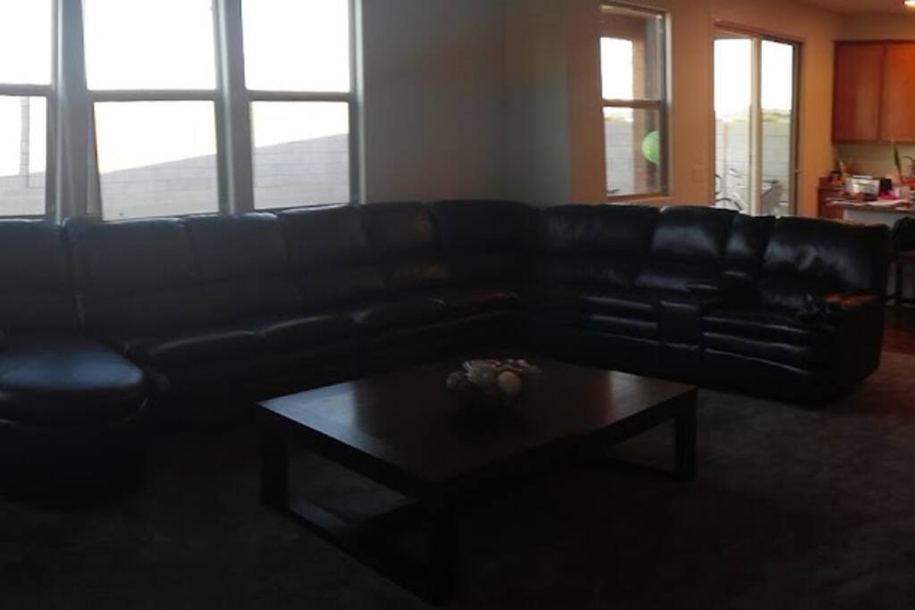 Open floor plan with great room and kitchen with island.