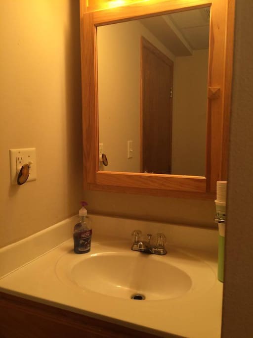 Bathroom sink & mirror.