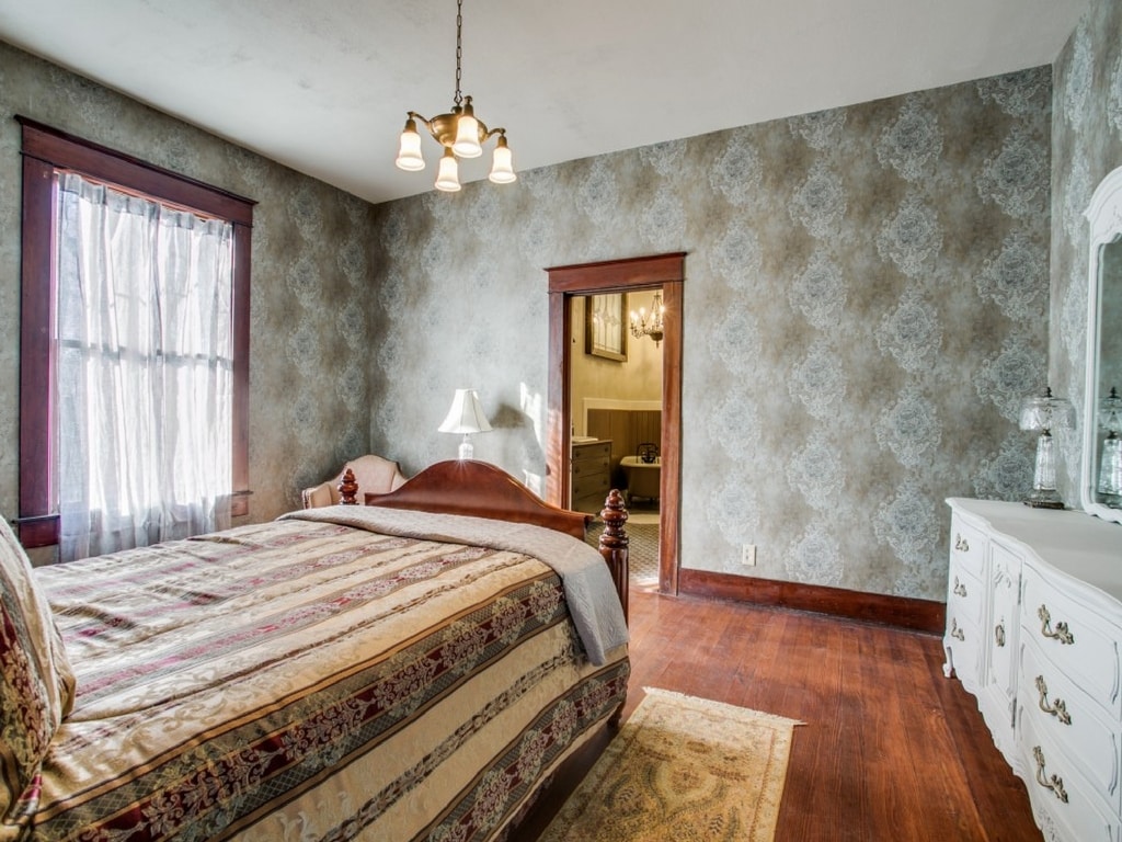The Master Suite with beautiful antique drawers, loveseat, crystal touches and treasures throughout. Lower level.