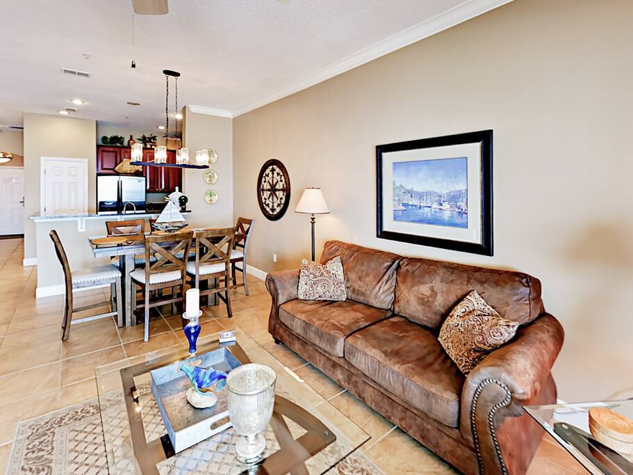 The living room includes comfy seating for 5 as well as a 58" flat screen TV with cable and a DVD player.