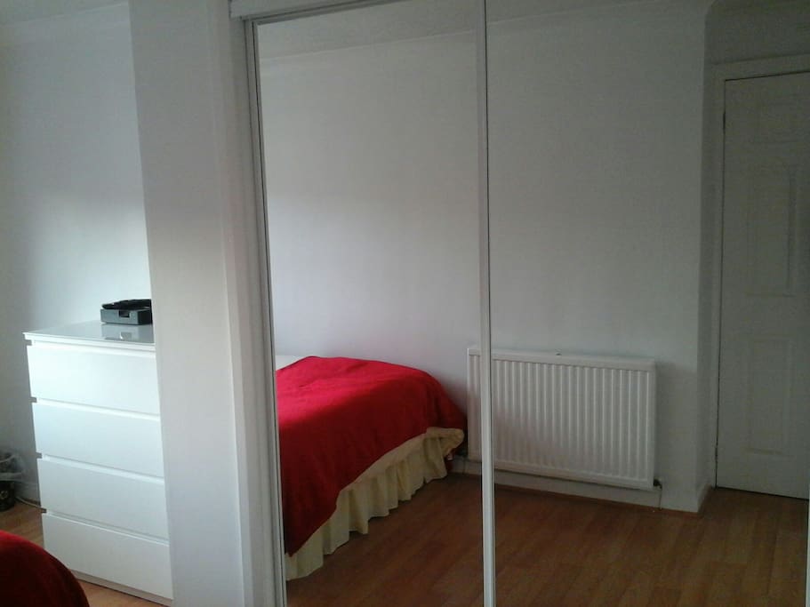 Double mirrored wardrobe in bedroom