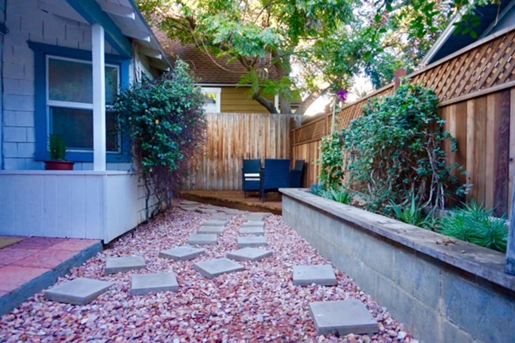 Private backyard, seating area, BBQ.