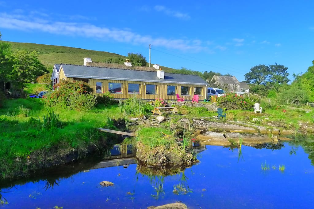 The thatch cottage has a substantial contemporary extension to take advantage of the bay views.