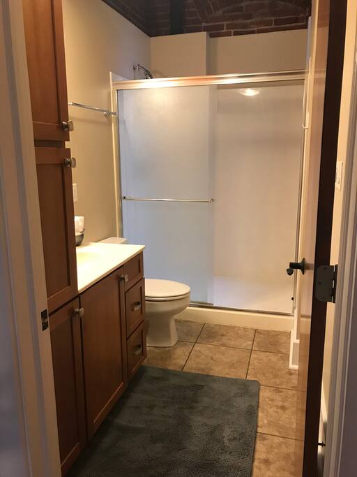 Bath with large shower.
