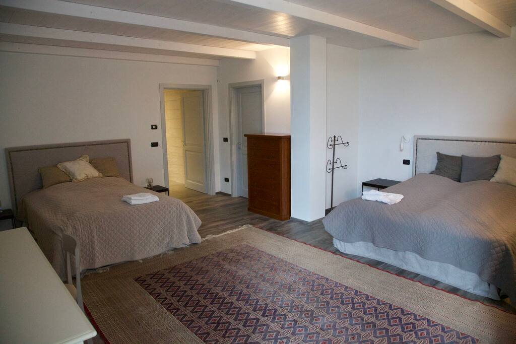 Large bedroom with a queen size and a double bed. Recently renovated. Very comfortable beds. Cool temperature in hot weather.