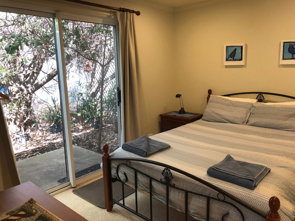 Two queen bedrooms open onto the garden