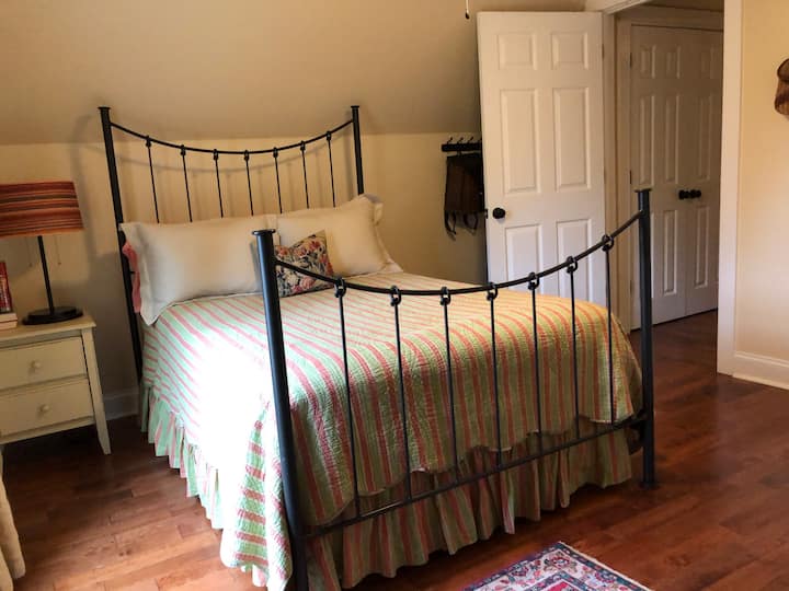 Full bed with side table and extra hooks for storage