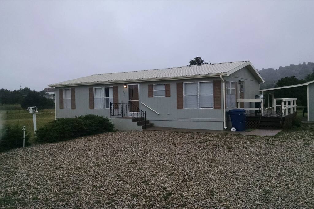 Exterior of the Mountain Home on a spacious lot with plenty of parking.