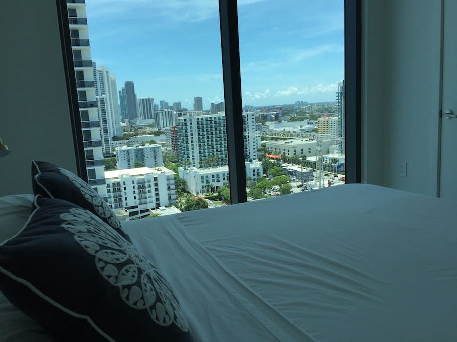 bedroom with bay and downtown views