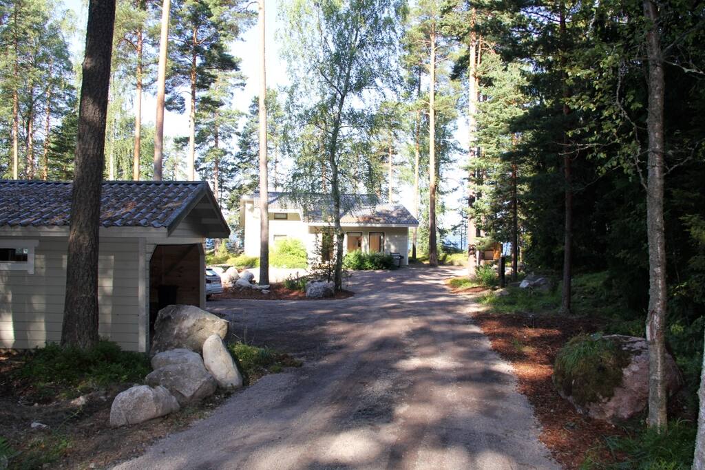 Driveway to the villa with garage on the left